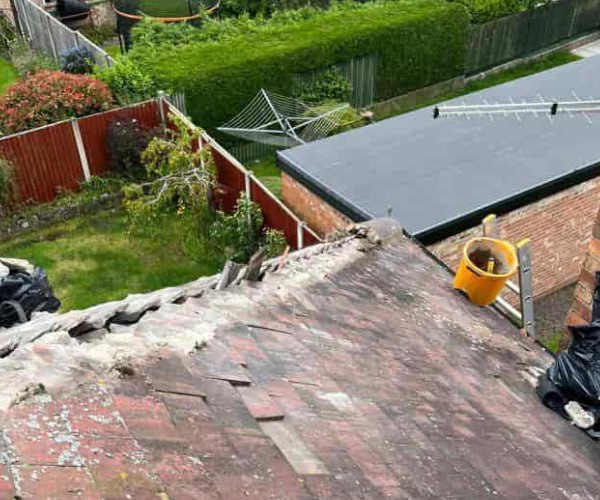 This is a photo of a roof hip that is having the hip (or bonnet) tiles replaced. Works carried out by KJ Roofing Crofton