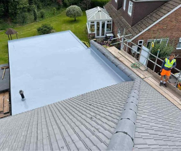 This is a photo of a newly installed hip roof, with a combined liquid covered flat roof. Work carried out by KJ Roofing Crofton